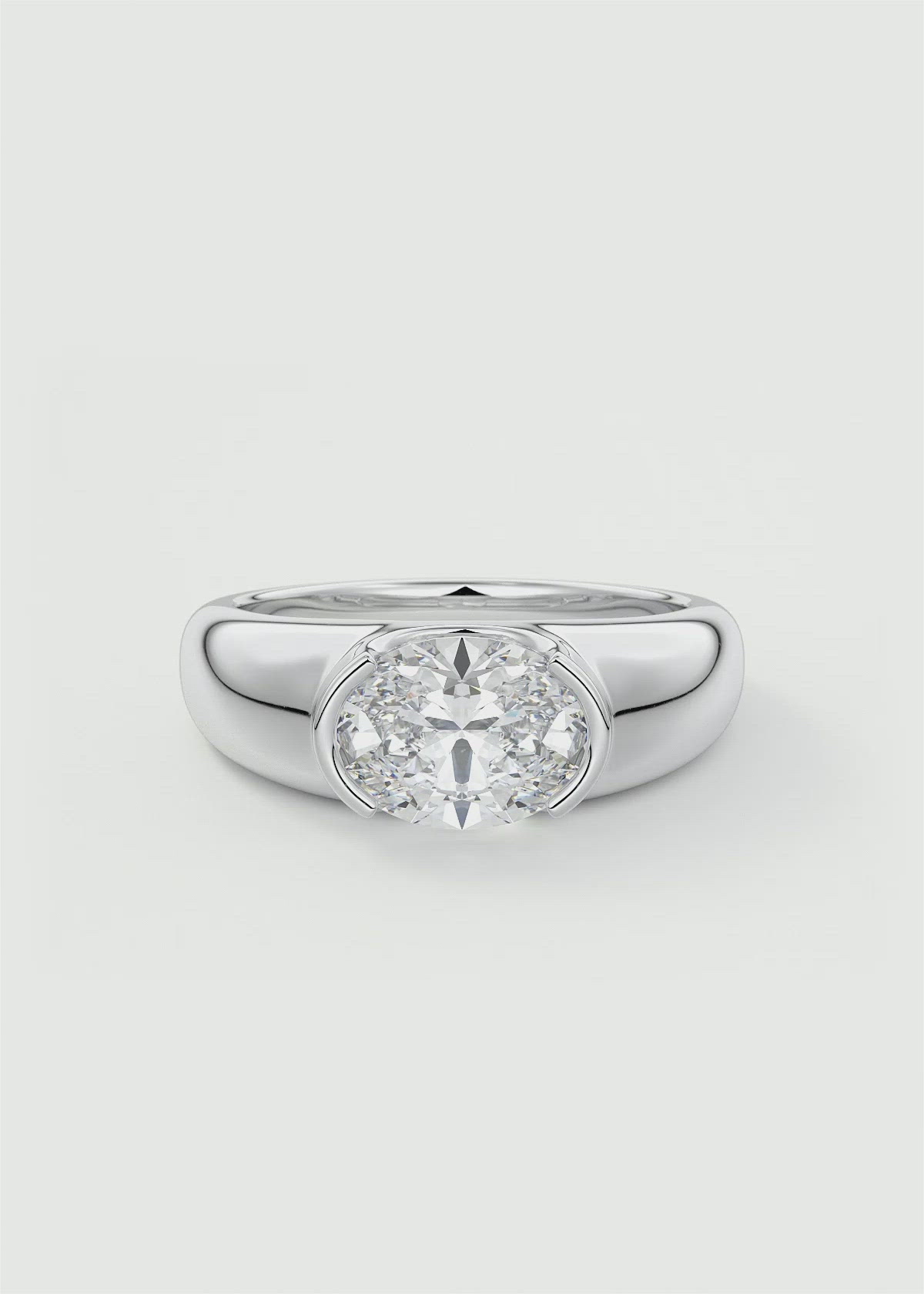 Chunky Half Bezel Oval Solitaire by Frank Darling